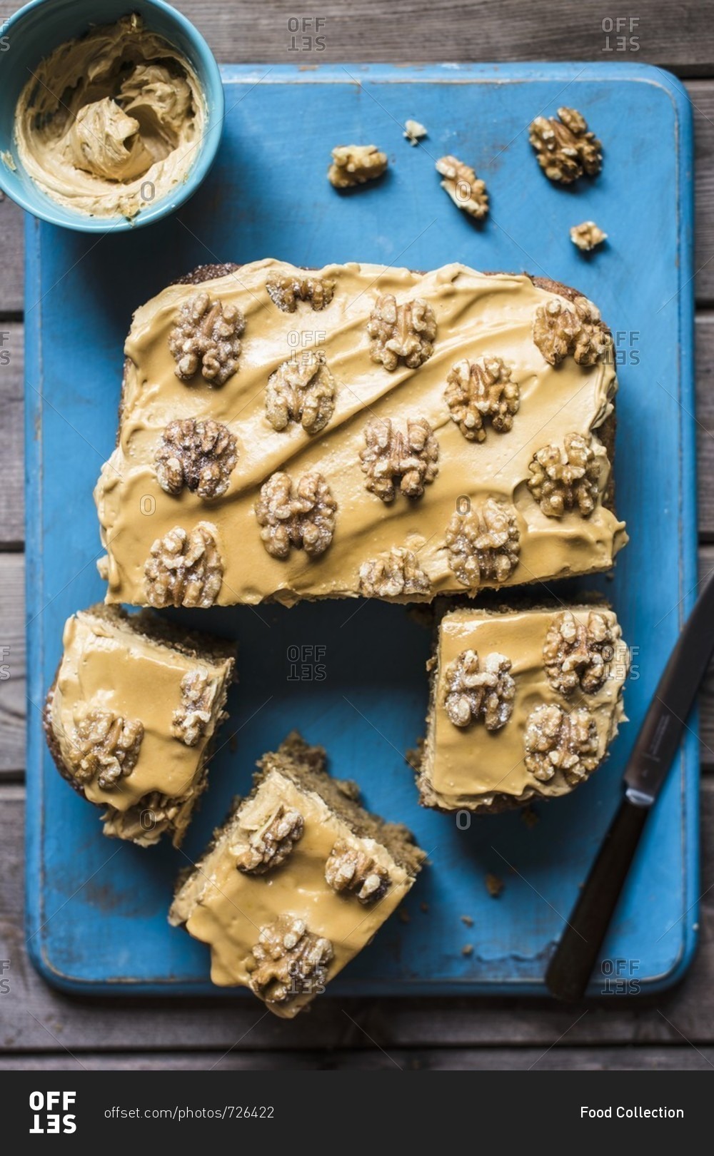 Coffee and walnut tray bake with coffee icing, sliced (seen from above