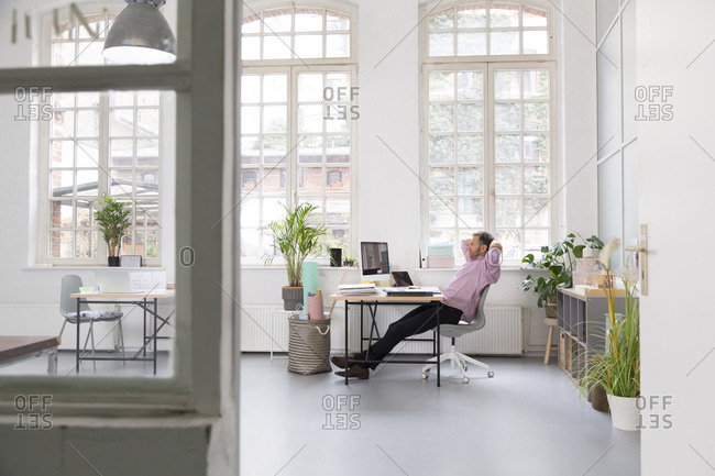Man working at desk in a loft office