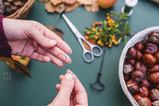 DIY, autumnal decoration, mobile, natural materials, crafting, women's hands, detail,
