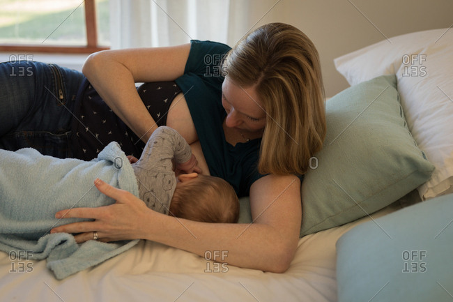 woman holding breasts stock photos - OFFSET