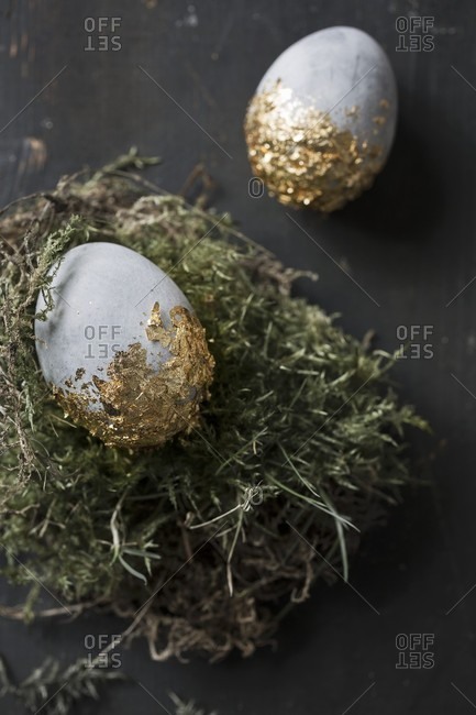 Easter Eggs Painted With Stone Effects And Gold Leaf On Moss Stock Photo Offset