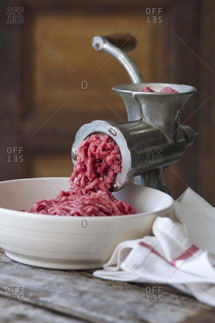 A meat grinder with freshly ground minced meat