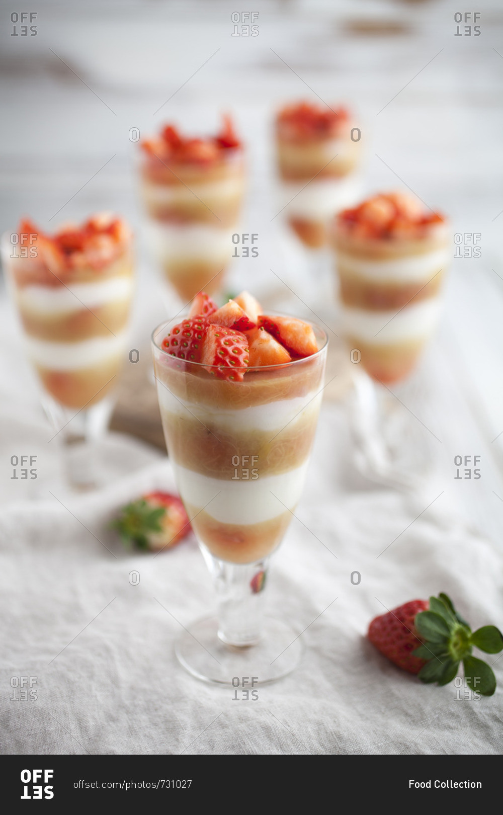 Creamy layered desserts with strawberries and rhubarb