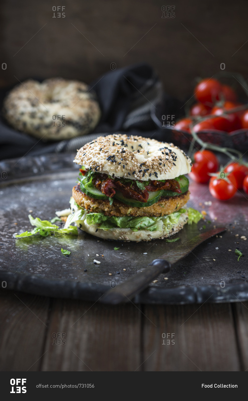 A chickpea and courgette fritter in a sesame seed bagel with dried