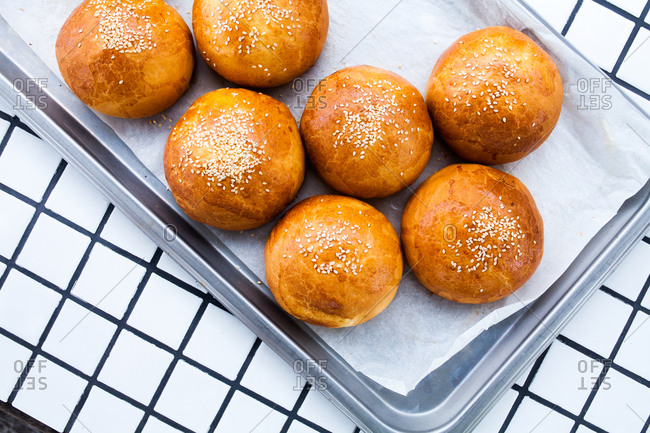 Freshly baked buns topped with sesame seeds