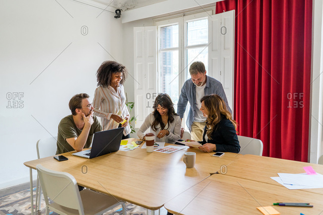 Colleagues discussing graphs