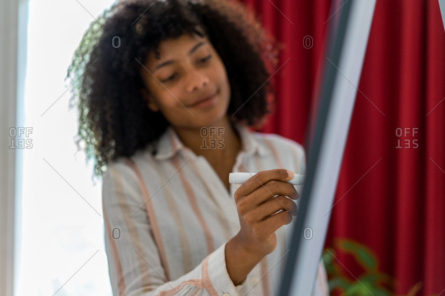 Woman giving presentation in office