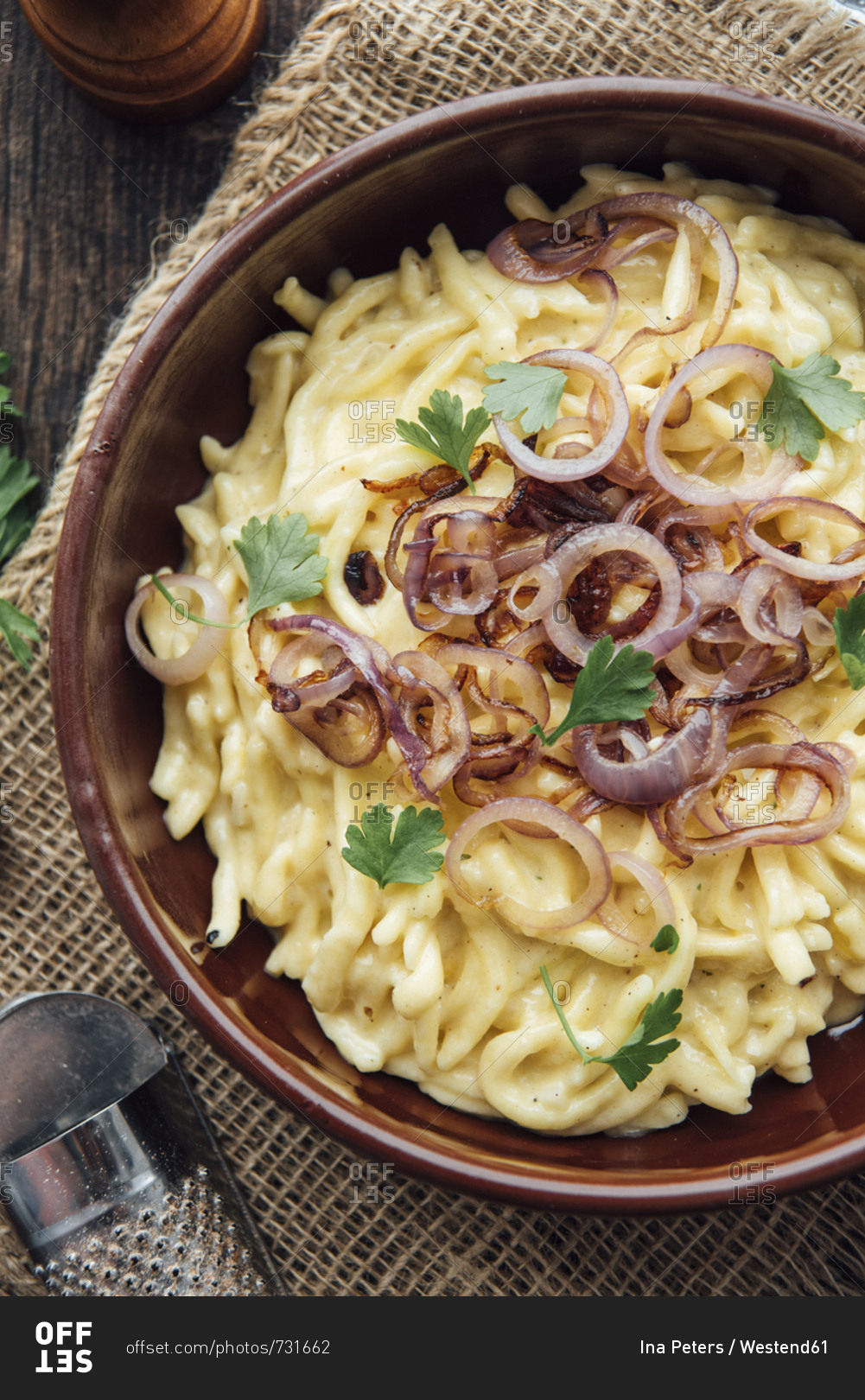 Traditional swabian cheese spaetzle egg noodles with cheese cream