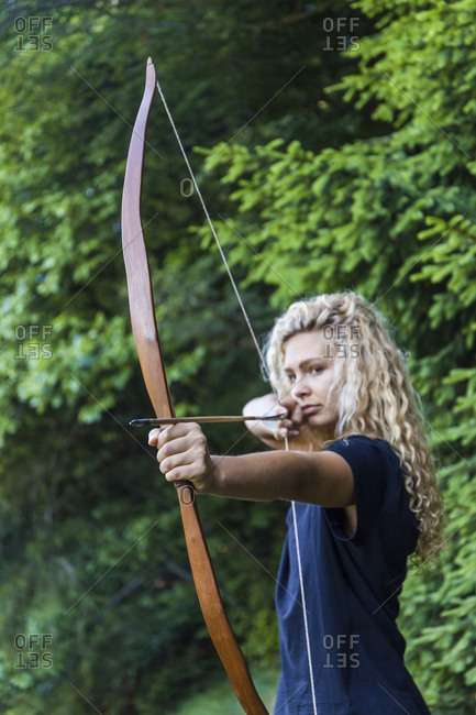 Archeress aiming with her bow