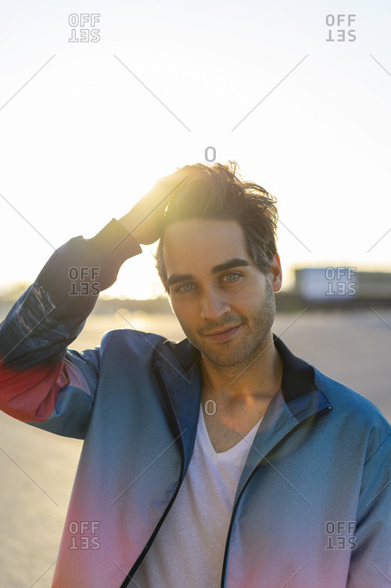 Man With Hand In Hair Portrait Stock Photo Offset
