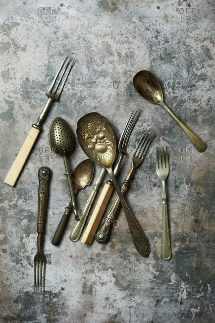Vintage cutlery on grungy background