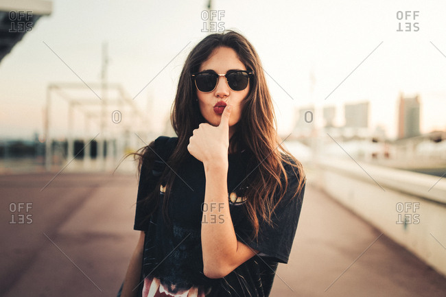 beautiful girl poses for camera in the city stock photo (152635) -  YouWorkForThem