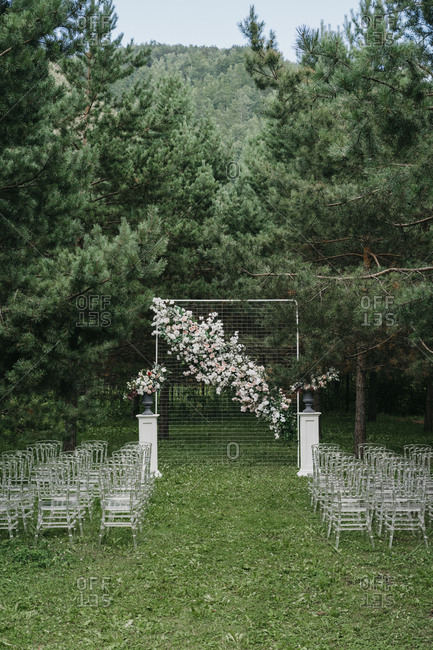Floral Alter And Seats At An Outdoor Wedding Ceremony Stock Photo