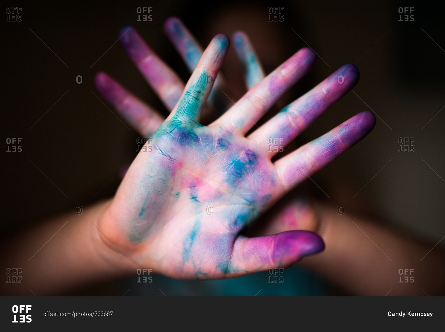 Closeup of a childs hands covered in bright colored dye stock photo