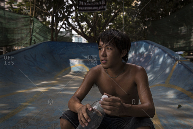 Yangon, Myanmar - April 28, 2016: Boys at a skatepark in Yangon, Myanmar