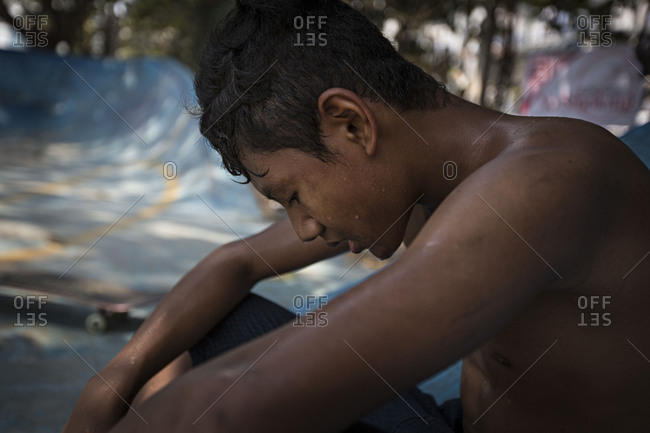 Yangon, Myanmar - April 28, 2016: Boys at a skatepark in Yangon, Myanmar