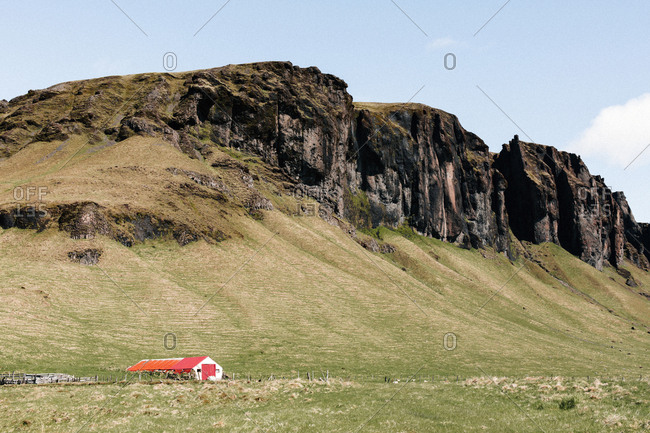 House by a mountain by Rind Road in Iceland