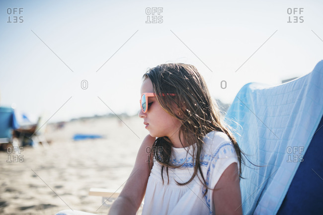 Portrait of a girl wearing sunglasses at the beach