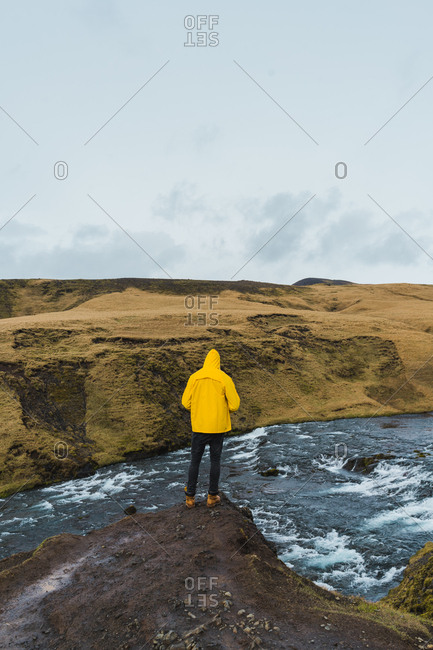 back view of person looking the view and river in Iceland