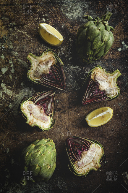 Top view of fresh artichokes over grunge background
