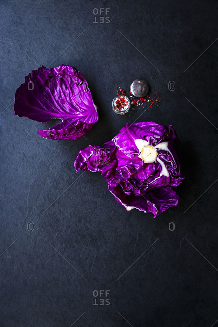 Top view of raw red cabbage with chili flakes and salt