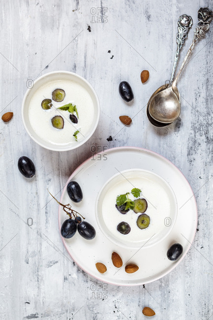 Ajo Blanco- white gazpacho- spanish cold soup- almonds and blue grapes- overhead view