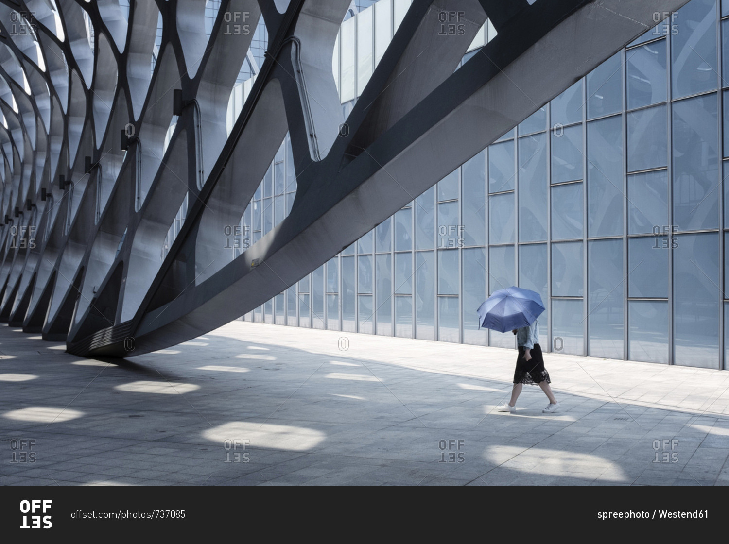 China- Shenzhen- modern architecture and walking woman