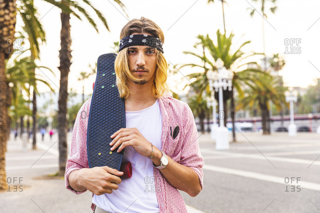 Portrait of serious skateboarder
