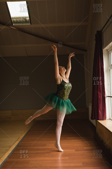 Beautiful Ballerina Practice Arabesque Ballet Position In Dance Studio Stock Photo Offset