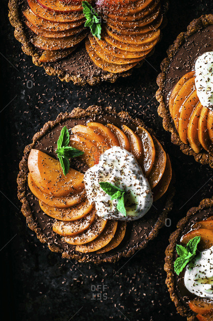 Chocolate ganache apricot tarts with almond oat pastry