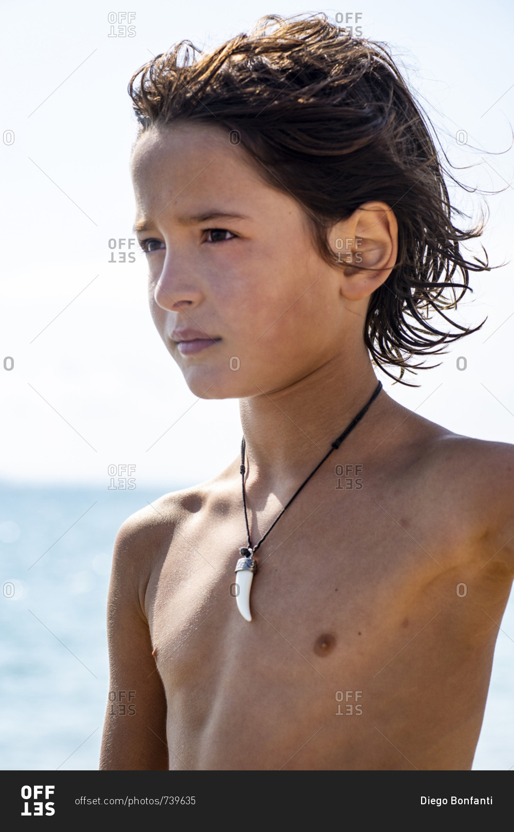 Portrait of shirtless boy on a summer day at the beach