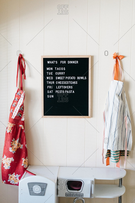 Weekly Menu On Black Letterboard With Kids Play Kitchen And