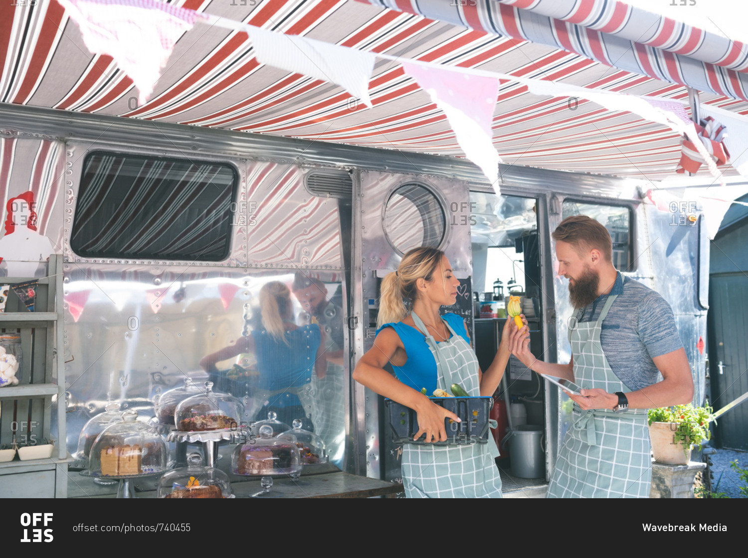 Couple interacting with each other near food truck