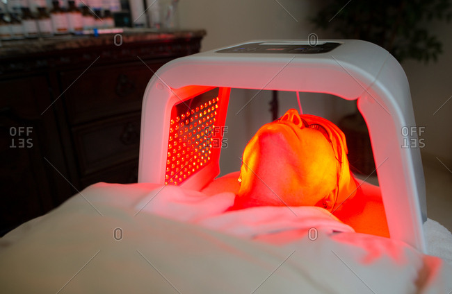 Woman receiving red light therapy