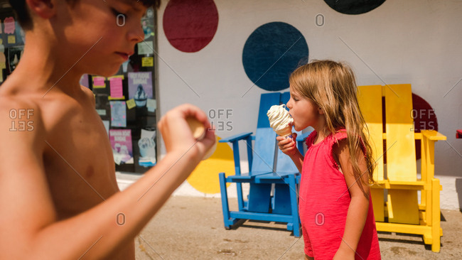 Children eating ice cream cones outside