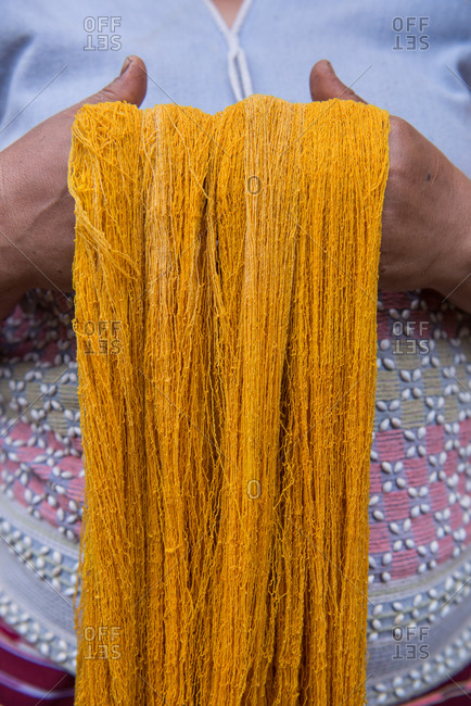 Close up on Asian Karen Hill Tribe Woman Holding Dye Fabric