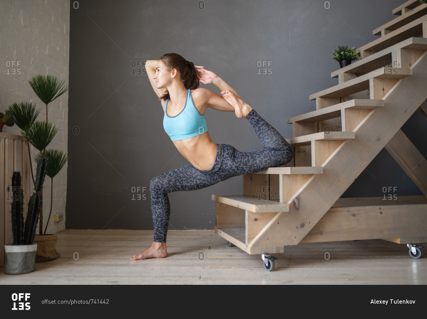 Young woman doing yoga poses on steps