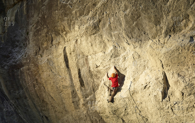 Austria- Innsbruck- Martinswand- man climbing in rock wall