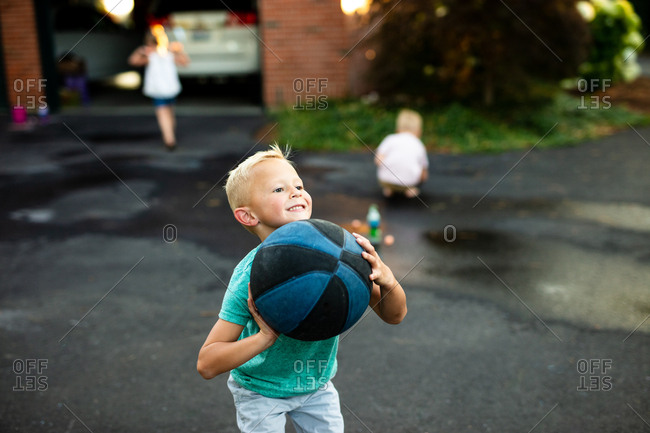 Boy plays basketball