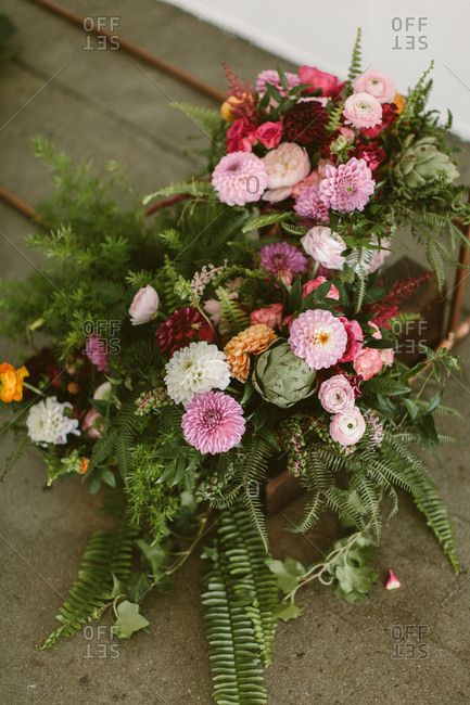 lush floral arrangement on concrete
