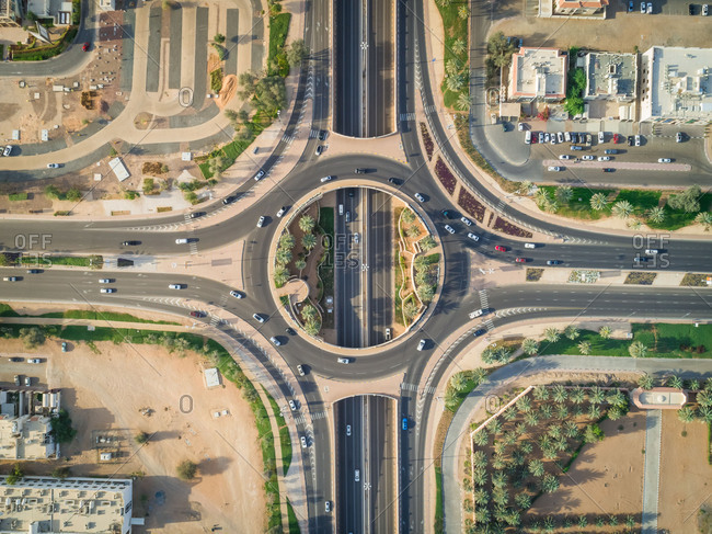 Aerial view of geometrical roundabout and roads in Al Jimi area, Abu Dhabi, UAE.
