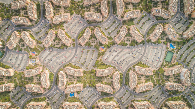 Aerial view of abstract, geometrical Discovery Gardens urban area, Dubai, UAE. stock photo - OFFSET
