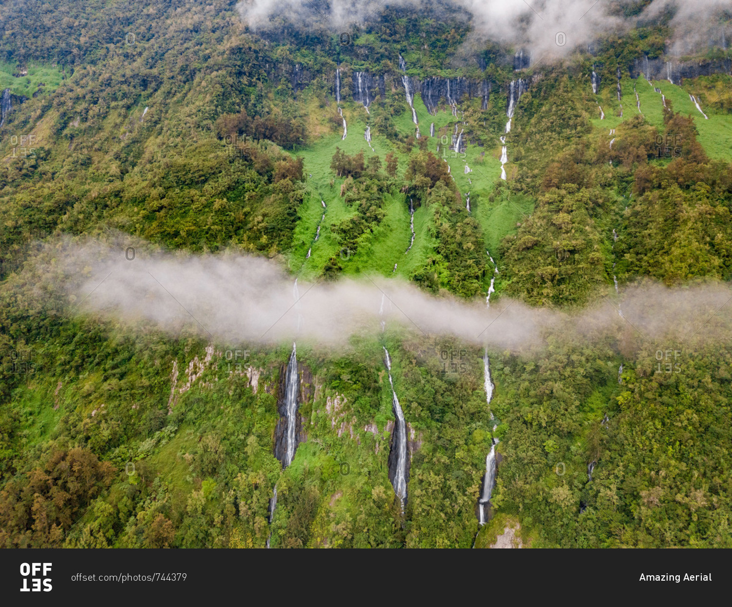 Aerial view of misty Voile de la Mariee waterfall, Reunion island.