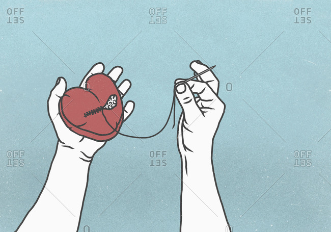 Hands sewing broken heart with needle and thread