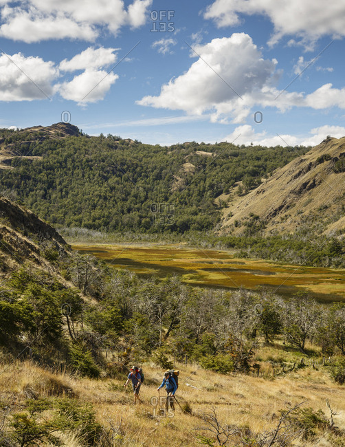 Patagonia, Aysen Region, Chile - February 16, 2016: Men hiking in the Chacabuco Valley, Parque Patagonia