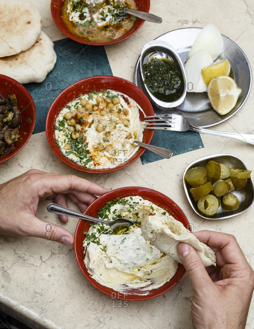 Jaffa, Tel Aviv, Israel - December 13, 2015: Hummus plates at Shlomo and Doron Hummus place at the Carmel Market