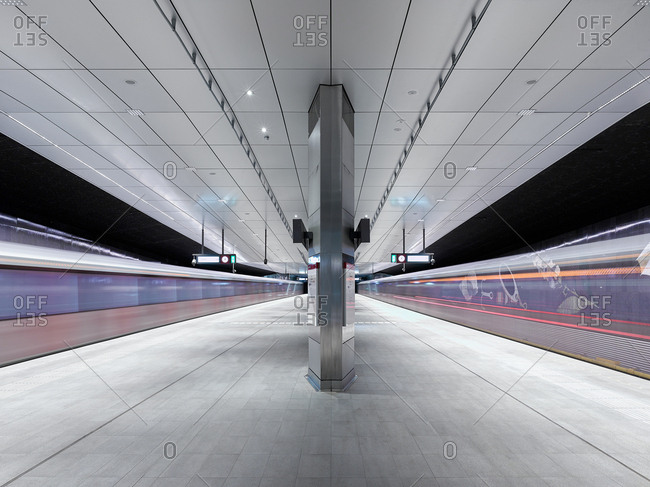 Subway cars speeding past the platform of the new Rokin station subway station in Amsterdam.