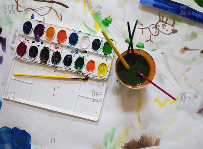 Palette of watercolor paint and brushes