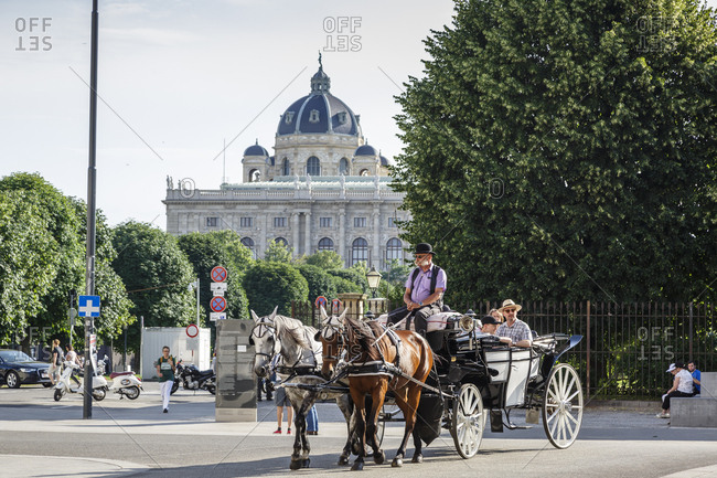June 2, 2018: Horse drawn carriage with the Natural History Museum (Naturhistorische Museum) in the background, Vienna, Austria.