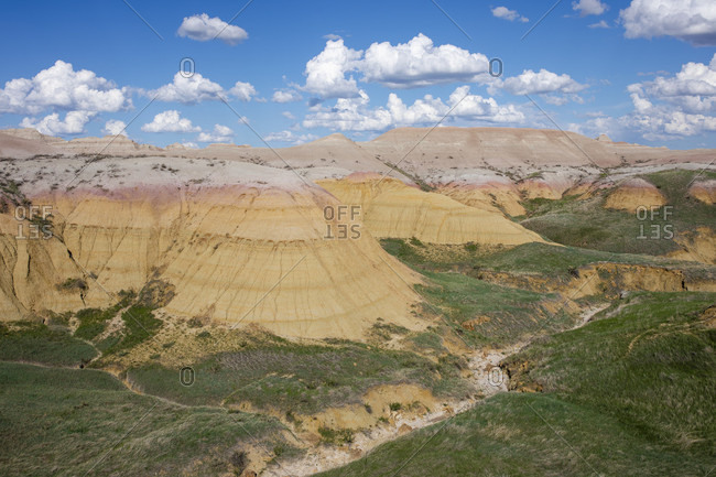 Scenic view of clouds over rock formations of Badlands National Park, South Dakota, USA